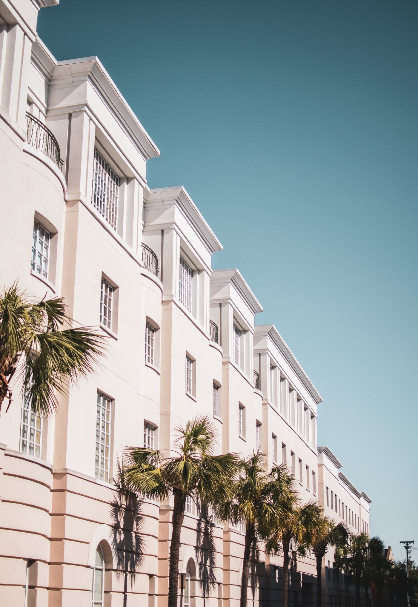 Pale residential facades with clean architectural lines