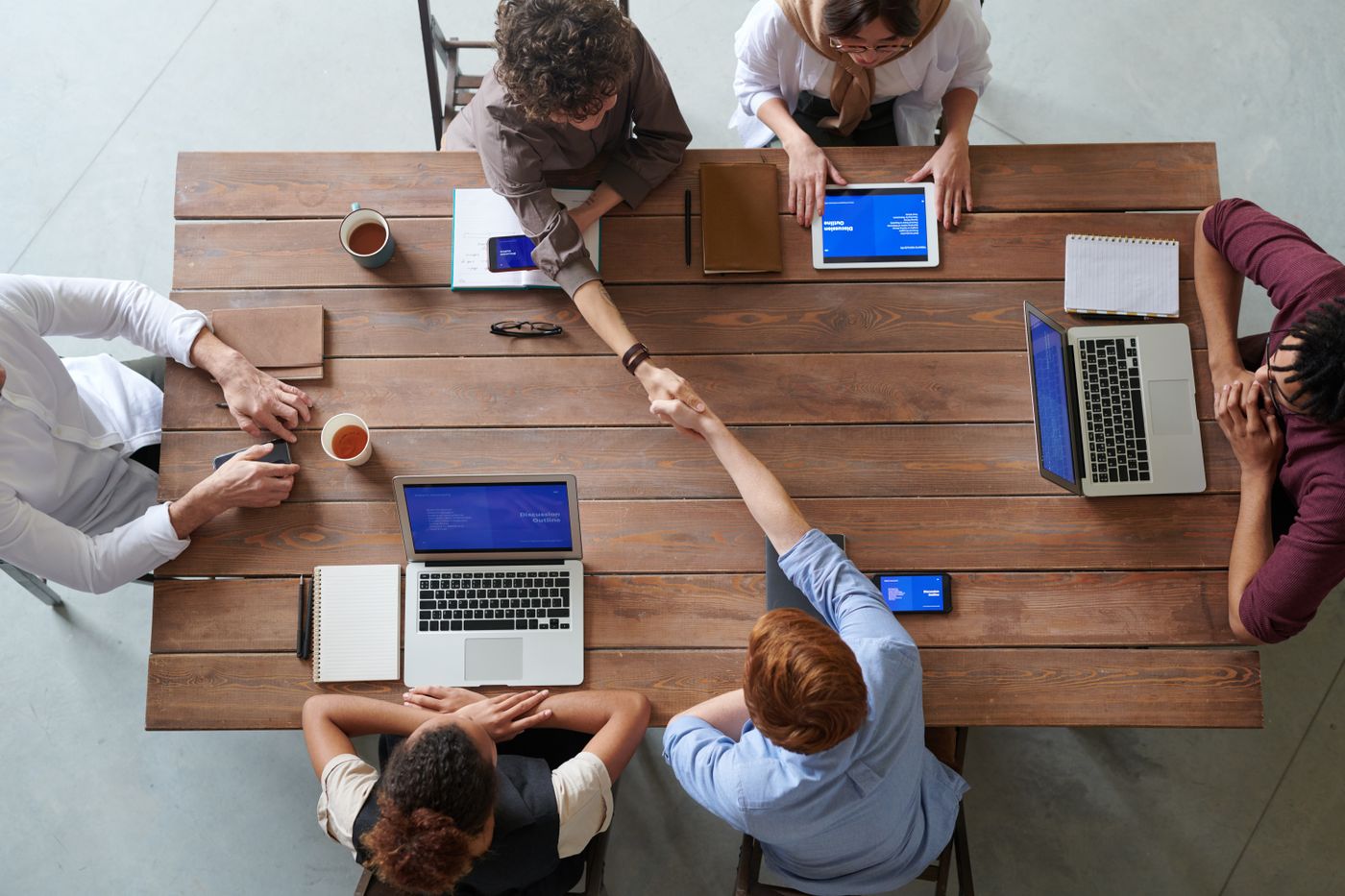 Overhead view of colleagues meeting around a table