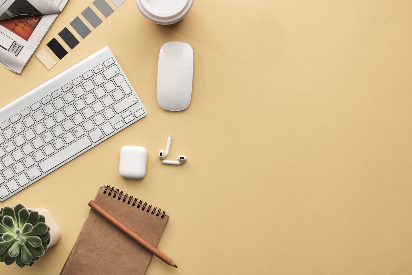 Organised desktop with notebook and keyboard