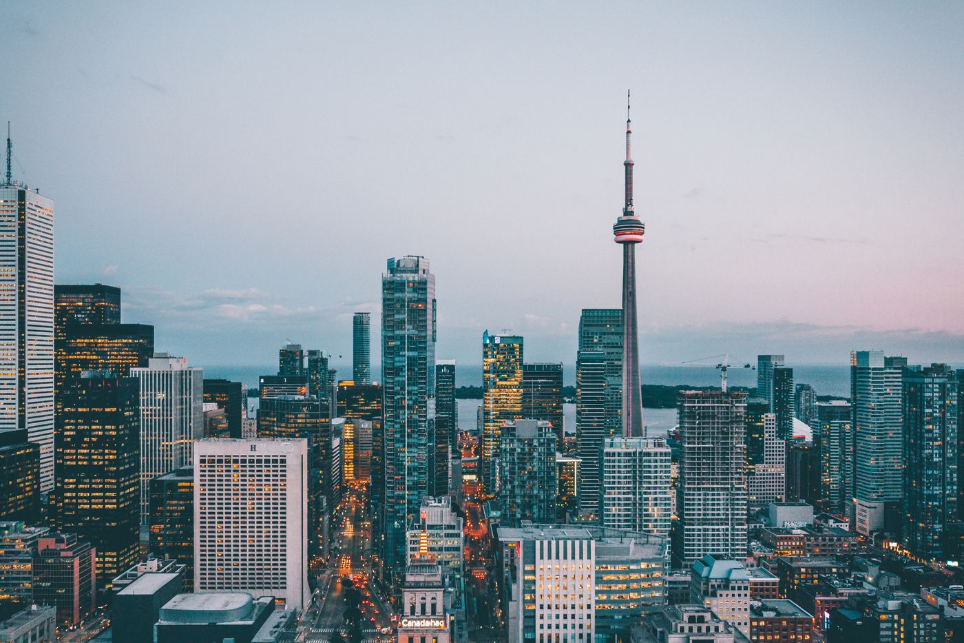 A city skyline with a communications tower